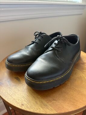 Doc Martens. Black Leather Platform Lace-Up Shoes with Yellow Stitching